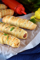 Sausages wrapped in puff dough. Fast food meal