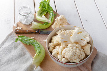 Organic cauliflower on wooden background