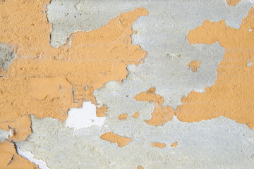 Orange color painted on cement wall are peeling