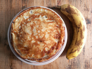 Banana pancakes with honey on a plate