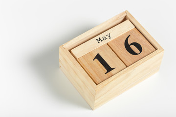 Wooden cubes with date on white background. 16th of May