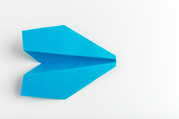 Flat lay of white paper plane on white color background