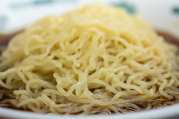 Close up of yellow noodle with soup (Japanese Ramen) Asian traditional food.