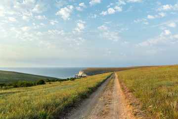 Clear sky over a blue sea by the beach  Cliffs background