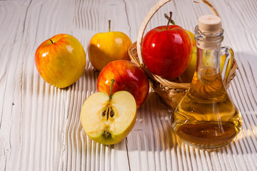 apple vinegar on a wooden rustic background