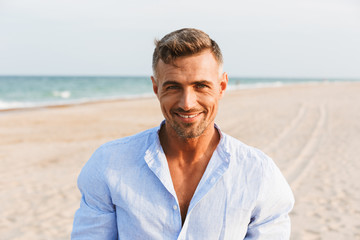 Fototapeta na wymiar Portrait of a handsome smiling man in shirt