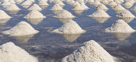 Raw salt or pile of salt from sea water in evaporation; ponds at Phetchaburi province