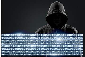 Thief in black clothes on grey background