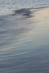 Beautiful sunset reflected on italian sea waves
