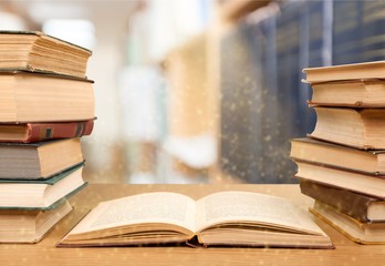 Old books on library background