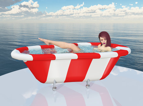 Junge Frau in einer Badewanne am Meer