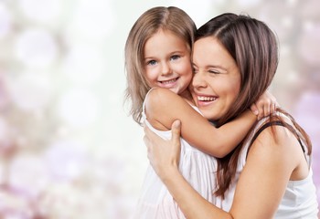 Happy Mother and daughter hugging