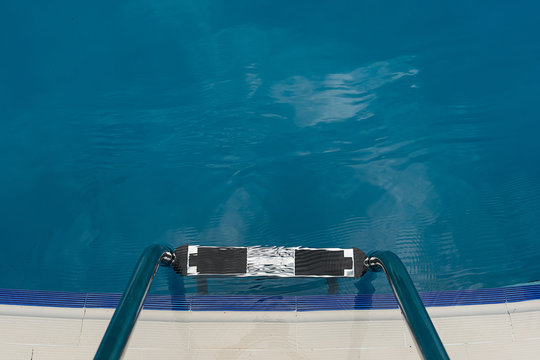 stainless steel ladder and swimming pool