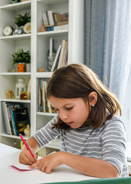 Cute Little School Girl Writing Birthday Cards