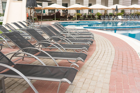 Sun beds at the edge of the pool
