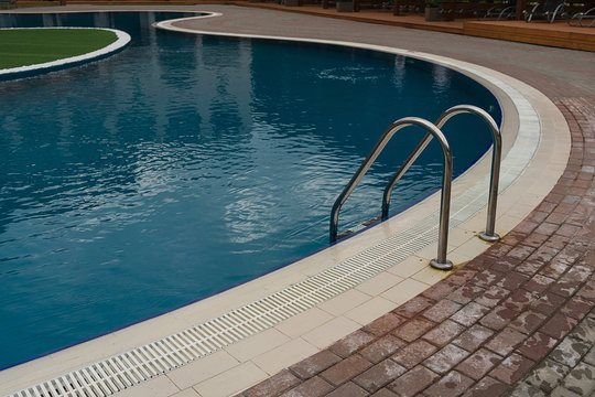 stainless steel ladder and swimming pool