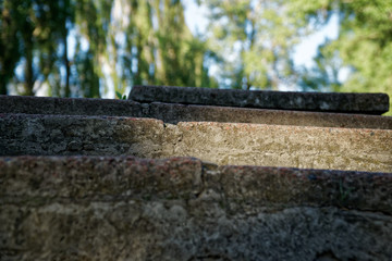 Brick grunge Stone stairs with leafs, defocused background