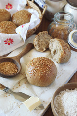 Fresh homemade sourdough bread buns with sesame