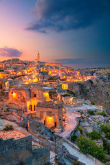 Matera, Italy. Cityscape aerial image of medieval city of Matera, Italy during beautiful sunset. - obrazy, fototapety, plakaty