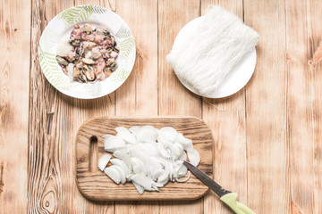 Seafood and rice spaghetti, chopped onions. Preparation of Thai, Chinese noodles with seafood.