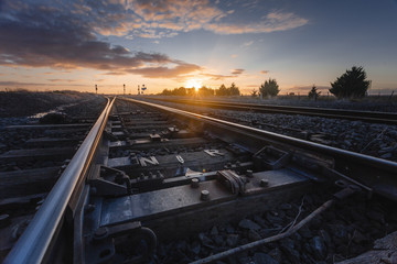 Sunset Over Railway Tracks, Low Perspective with Detail View of Scene.