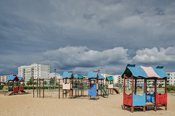 CITY DISTRICT - Storm clouds over the children's playground in Kolobrzeg
