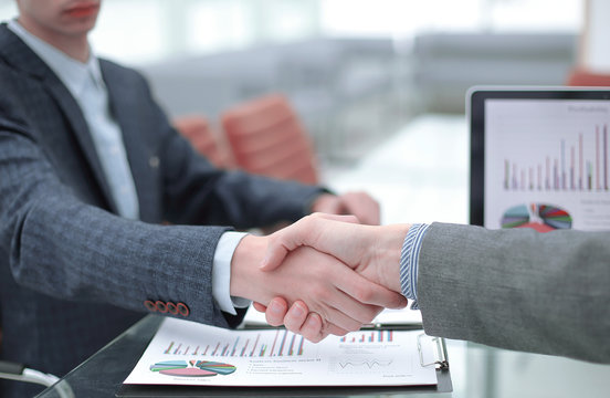 close up.handshake business partners in the workplace in the office