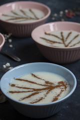Bowls of rice porridge with cinnamon