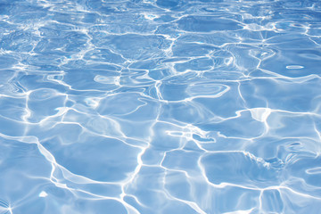 Texture of water in swimming pool for background