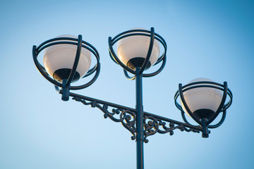 Street lamp on the background of the clear sky