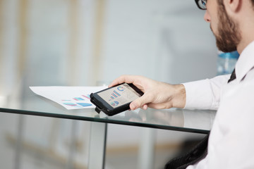 Close up of a man using mobile smart phone