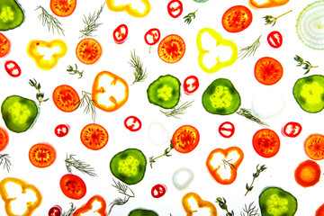 Collection of sliced vegetables and herbs.