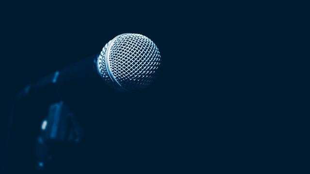 dynamic microphone on black, music background