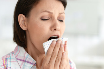 Close up portrait of sick young woman crying