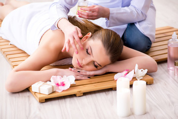 Obraz na płótnie Canvas Young woman during spa procedure in salon