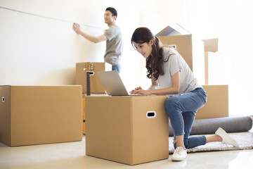 Happy young couple moving to a new house