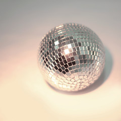 beautiful disco ball on yellow background isolated.