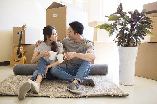 Happy young couple moving to a new house
