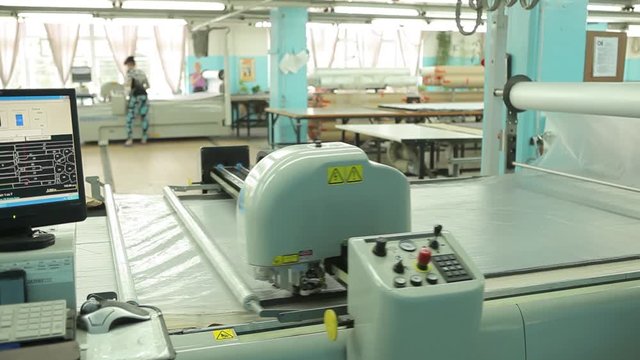 Equipment of a modern weaving factory. Large industrial plotter in operation. Video.
