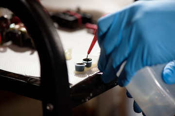 Tattoo artist at work. Closeup