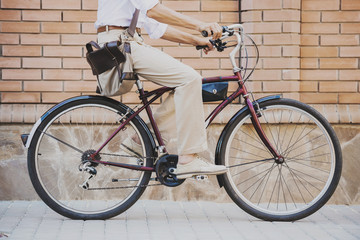 Fototapeta na wymiar Close up. Man Sitting on Bicycle Outdoor in Summer