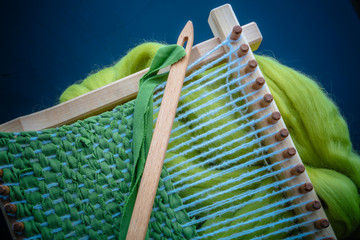 loom with greenwool for felting