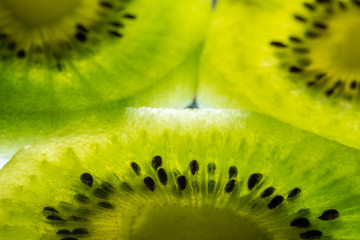 Kiwi fruit texture background with selective focus and crop fragment