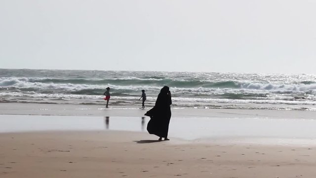 Family on the Beach in Morocco Enjoying the Day