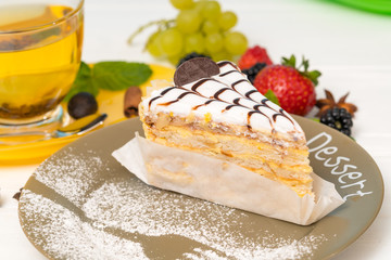 Biscuit layer cake with decorative creamy icing
