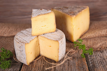 cheese on wood background