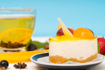 Layered creamy mousse cake with fruit topping