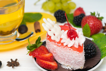 Piece of fruit cake topped with white chocolate