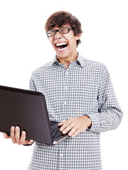 Guy loudly laughing with laptop