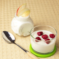 Dietary food. Natural home dairy product. Fruit yogurt with fresh pear and raspberries.